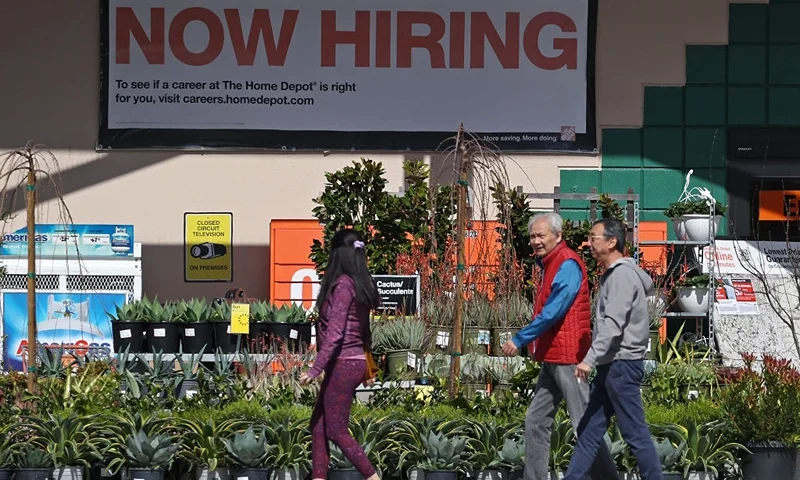 SAN RAFAEL, CALIFORNIA - MARCH 08: Home Depot customers walk by a posted now hiring sign on March 08, 2024 in San Rafael, California. According to a report from the Bureau of Labor Statistics, the U.S. labor market added 275,000 nonfarm payroll jobs in February, beating analyst expectations of 200,000. The unemployment rate inched up to 3.9% from 3.7% in January. (Photo by Justin Sullivan/Getty Images)