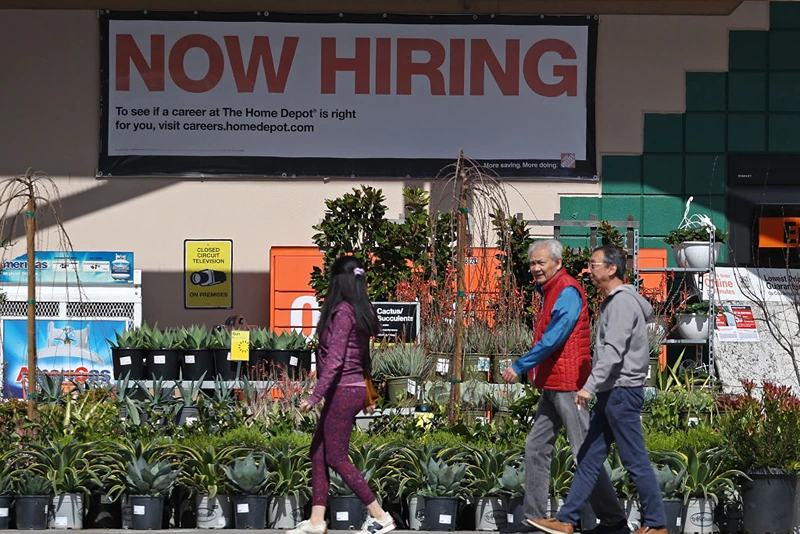 SAN RAFAEL, CALIFORNIA - MARCH 08: Home Depot customers walk by a posted now hiring sign on March 08, 2024 in San Rafael, California. According to a report from the Bureau of Labor Statistics, the U.S. labor market added 275,000 nonfarm payroll jobs in February, beating analyst expectations of 200,000. The unemployment rate inched up to 3.9% from 3.7% in January. (Photo by Justin Sullivan/Getty Images)