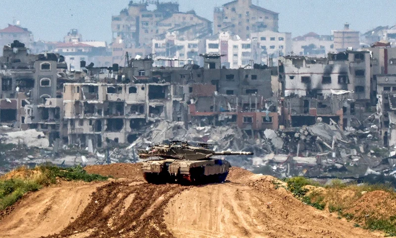 TOPSHOT - This picture taken from Israel's southern border with the Gaza Strip shows Israeli army battle tank at a position along the border with the Palestinian territory on March 19, 2024, amid the ongoing conflict between Israel and the militant group Hamas. (Photo by JACK GUEZ / AFP) (Photo by JACK GUEZ/AFP via Getty Images)