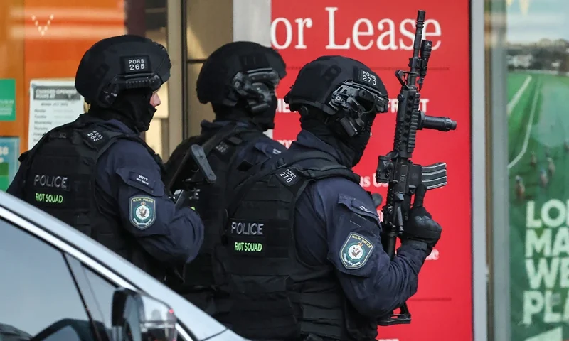 Police enter the Westfield Bondi Junction shopping mall after a stabbing incident in Sydney on April 13, 2024. Australian police on April 13 said they had received reports that "multiple people" were stabbed at a busy shopping centre in Sydney. (Photo by David GRAY / AFP) (Photo by DAVID GRAY/AFP via Getty Images)