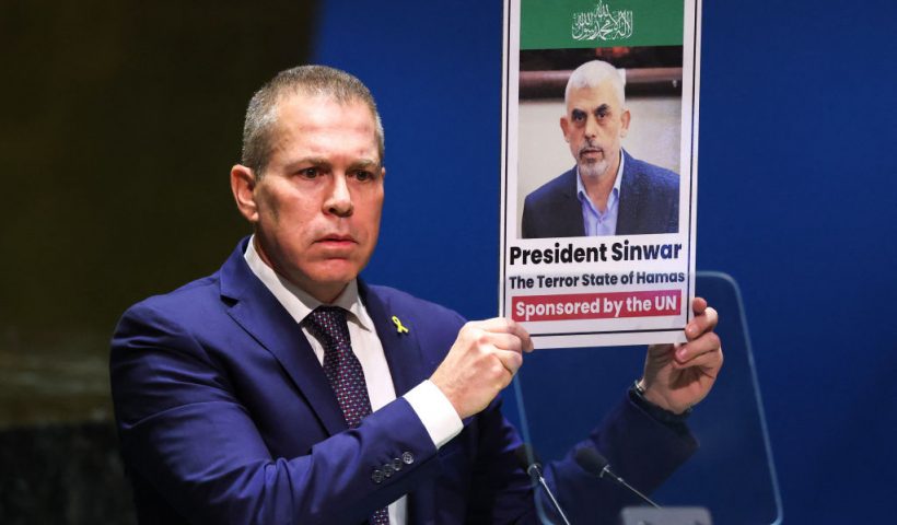 Israeli Ambassador to the United Nations Gilad Erdan holds up a picture of Hamas leader Yahya Sinwar during a special session of the UN General Assembly regarding the Palestinian bid for full membership to the UN, at UN headquarters in New York City on May 10, 2024. A veto from the United States during an April 18, 2024 UN Security Council meeting previously foiled the Palestinians' drive for full UN membership. (Photo by Charly TRIBALLEAU / AFP) (Photo by CHARLY TRIBALLEAU/AFP via Getty Images)