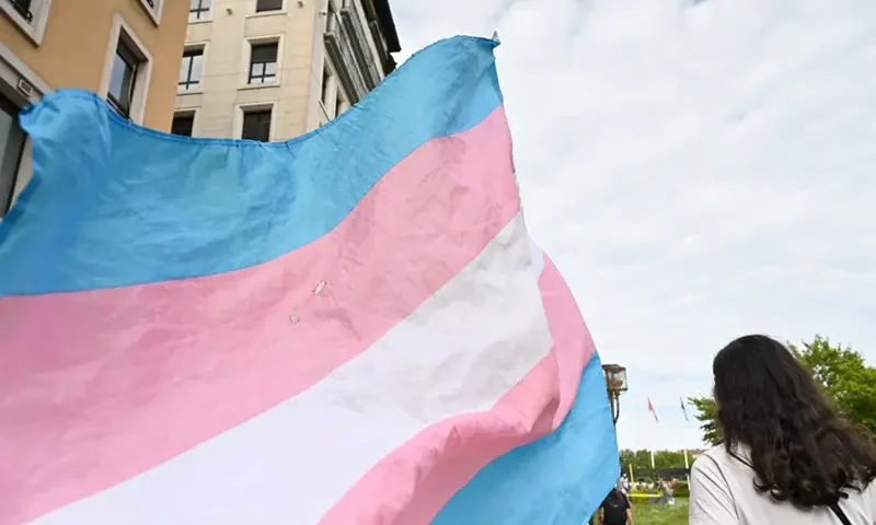 A transgender flag flies during a demonstration for trans rights in Lyon, France on 25 May 2024. (Photo by Matthieu Delaty / Hans Lucas / Hans Lucas via AFP) (Photo by MATTHIEU DELATY/Hans Lucas/AFP via Getty Images)