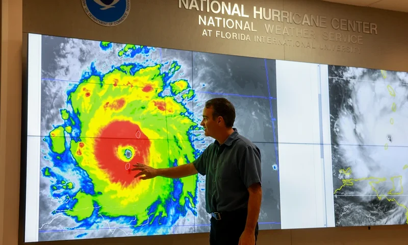 National Hurricane Center Monitors Hurricane Beryl's Activity In The Caribbean MIAMI, FLORIDA - JULY 01: John Cangialosi, Senior Hurricane Specialist at the National Hurricane Center, inspects a satellite image of Hurricane Beryl, the first hurricane of the 2024 season, at the National Hurricane Center on July 01, 2024 in Miami, Florida. On Monday afternoon, the storm, centered 30 miles west-northwest of Carriacou Island, became the strongest hurricane this early in the season in this area of the Atlantic. (Photo by Joe Raedle/Getty Images)