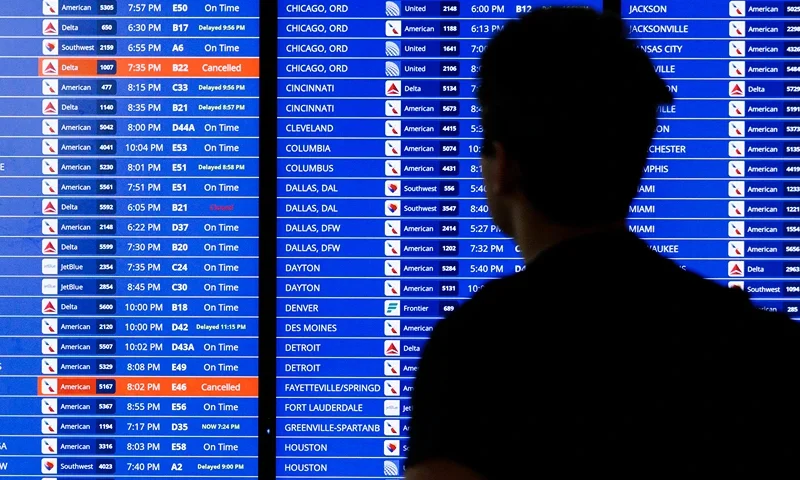 A flight departure information board is seen on Tuesday July 23, 2024 at Ronald Reagan Airport in Arlington, Virginia. A massive Crowdstrike outage impacting Microsoft systems continued to cause residual delays for air travel. (Photo by Aaron Schwartz / Middle East Images / Middle East Images via AFP) (Photo by AARON SCHWARTZ/Middle East Images/AFP via Getty Images)