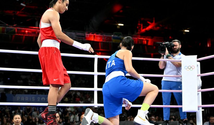 Algeria's Imane Khelif (in red) gestures to Italy's Angela Carini in the women's 66kg preliminaries round of 16 boxing match during the Paris 2024 Olympic Games at the North Paris Arena, in Villepinte on August 1, 2024. (Photo by MOHD RASFAN / AFP) (Photo by MOHD RASFAN/AFP via Getty Images)