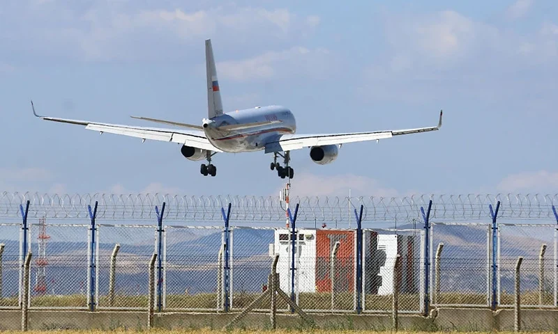 A Russian Tupolev Tu-204-300 aircraft prepares to land at Ankara Esenboga Airport in Ankara on August 1, 2024, as Turkish authorities anounced that 26 prisoners have been exchanged with Russia and West. Turkey has coordinated in Ankara an exchange of twenty-six prisoners between Russia and several Western countries, including the American journalist Evan Gershkovich, the Turkish Presidency announced. (Photo by Caglar OSKAY / AFP) (Photo by CAGLAR OSKAY/AFP via Getty Images)