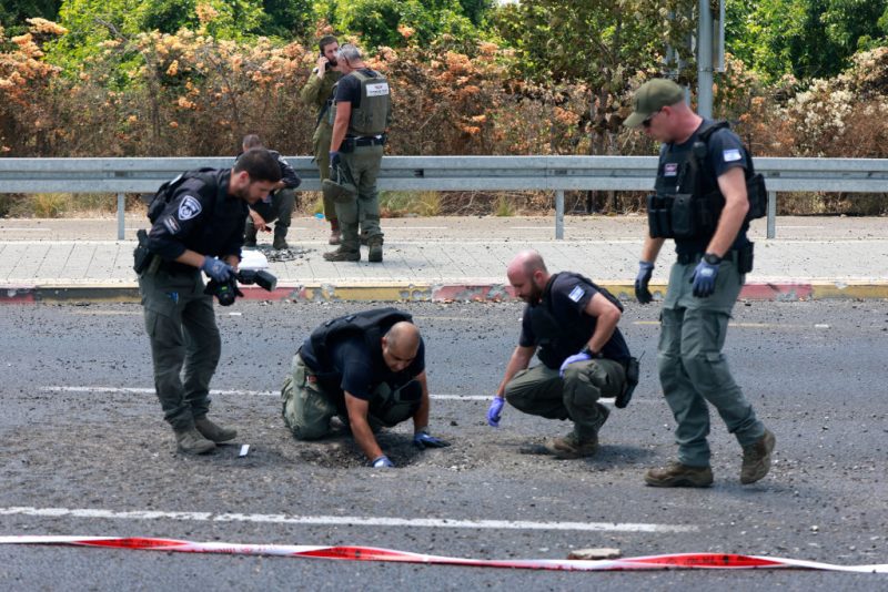 Israeli police check the site of a Hezbollah explosive drone attack near the northern city of Nahariya, on August 6, 2024, amid regional tensions during the ongoing war between Israel and the Palestinian Hamas movement in the Gaza Strip. A Lebanese security source said an Israeli strike killed five Hezbollah fighters in the south, with the group claiming attacks on northern Israel, including one with explosive drones. (Photo by Menahem KAHANA / AFP) (Photo by MENAHEM KAHANA/AFP via Getty Images)