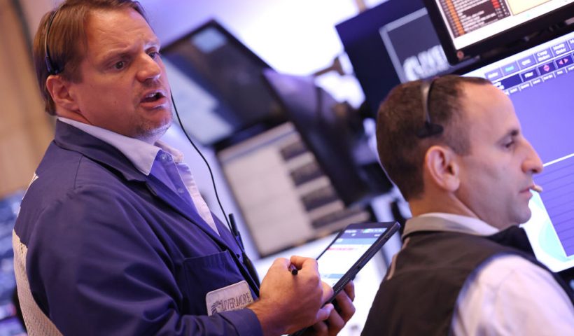 NEW YORK, NEW YORK - AUGUST 06: Traders work on the floor of the New York Stock Exchange during morning trading on August 06, 2024 in New York City. Stocks opened up slightly up in the three major indexes a day after the Dow Jones and the S & P 500 had their worst day of trading since 2022, amid a global market sell-off centered around fears of a U.S. recession. (Photo by Michael M. Santiago/Getty Images)
