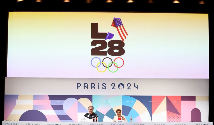 PARIS, FRANCE - AUGUST 10: A general view as the LED screen, depicting the LA28 Olympics logo, is seen whilst Casey Wasserman, LA28 Chairperson and President, and Karen Bass, Mayor of Los Angeles, speak at the LA28 Press Conference on day fifteen of the Olympic Games Paris 2024 at the Main Press Centre on August 10, 2024 in Paris, France. (Photo by Luke Hales/Getty Images)