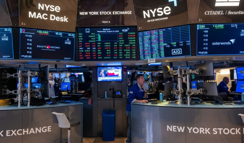 NEW YORK, NEW YORK - AUGUST 14: Traders work on the floor of the New York Stock Exchange (NYSE) on August 14, 2024 in New York City. According to the Bureau of Labor Statistics’ latest CPI report, consumer prices rose 2.9% in July, slowing from June’s 3% annual gain. (Photo by Spencer Platt/Getty Images)