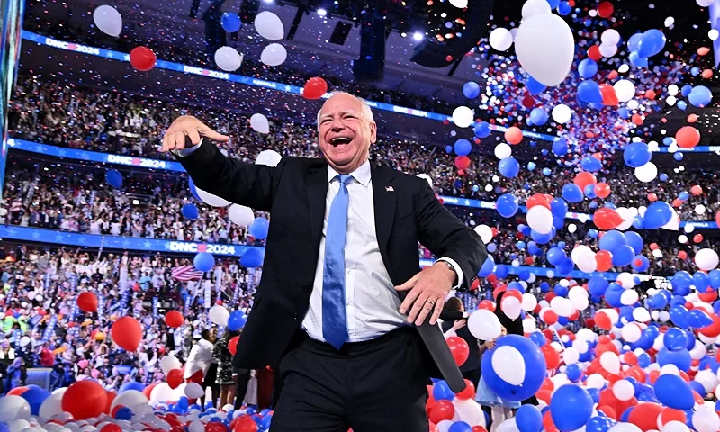 Minnesota Governor and 2024 Democratic vice presidential candidate Tim Walz gestures as balloons drop at the conclusion of the fourth and last day of the Democratic National Convention (DNC) at the United Center in Chicago, Illinois, on August 22, 2024. Vice President Kamala Harris formally accepted the party's nomination for president today at the DNC which ran from August 19-22 in Chicago. (Photo by Robyn Beck / AFP) (Photo by ROBYN BECK/AFP via Getty Images)