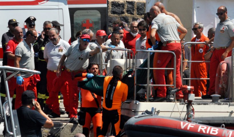 Divers of the Vigili del Fuoco, the Italian Corps. of Firefighters carry the body of Hannah Lynch, the last missing person at Porticello harbor near Palermo, on August 23, 2024, four days after the British-flagged luxury yacht Bayesian sank. Divers searching a sunken superyacht off Sicily for UK tech tycoon Mike Lynch's teenage daughter found a body, a coastguard official told AFP. Lynch's daughter Hannah, 18, had been the last person missing after his family's luxury yacht sank off the Italian island killing the businessman and five others. The Bayesian, which had 22 people aboard including 10 crew, was anchored some 700 metres from port before dawn when it was struck by a waterspout. (Photo by Alessandro FUCARINI / AFP) (Photo by ALESSANDRO FUCARINI/AFP via Getty Images)