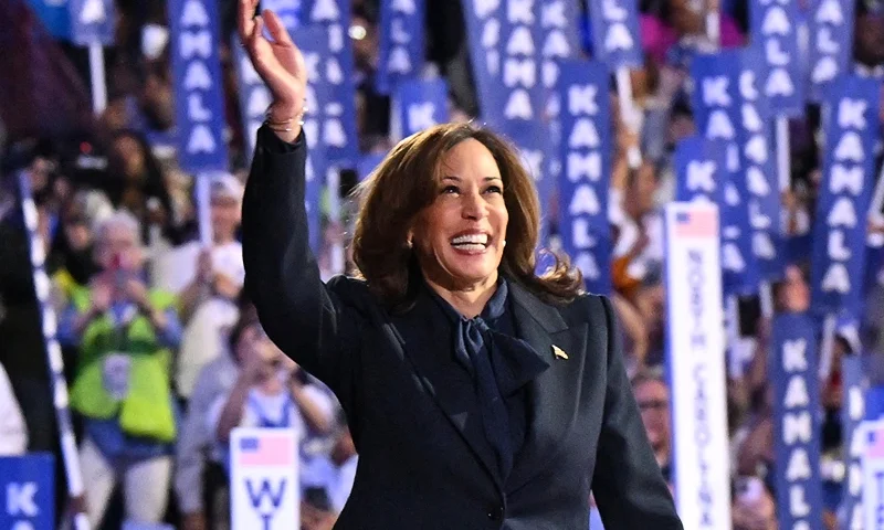 TOPSHOT - US Vice President and 2024 Democratic presidential candidate Kamala Harris waves as she arrives to speak on the fourth and last day of the Democratic National Convention (DNC) at the United Center in Chicago, Illinois, on August 22, 2024. Vice President Kamala Harris formally accepted the party's nomination for president today at the DNC which ran from August 19-22 in Chicago. (Photo by Robyn Beck / AFP) (Photo by ROBYN BECK/AFP via Getty Images)