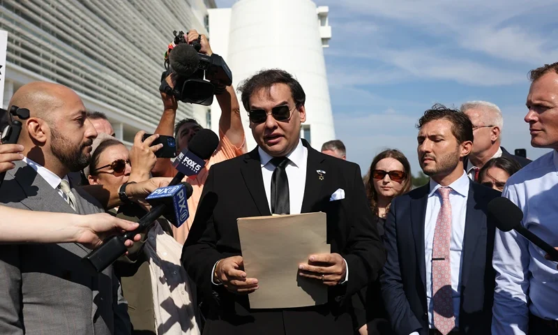 WEST ISLIP, NEW YORK - AUGUST 19: Former U.S. Rep. George Santos gives a statement after a court hearing on August 19, 2024 in West Islip, New York. Santos pleaded guilty to wire fraud and aggravated identity theft weeks before his federal trial was set to begin. His sentencing has been scheduled for February 7, and he faces more than six years in prison under federal sentencing guidelines. Santos owes at least $370,000 in restitution. He was expelled from Congress in 2023, becoming the sixth member in the chamber’s history to be ousted by colleagues. (Photo by Michael M. Santiago/Getty Images)