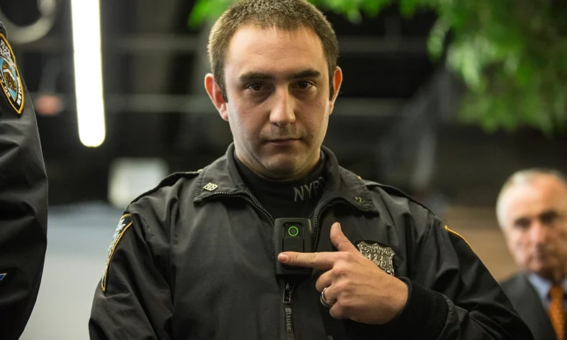 NEW YORK, NY - DECEMBER 03: New York Police Department (NYPD) Officer Joshua Jones demonstrates how to use and operate a body camera during a press conference on December 3, 2014 in New York City. The NYPD is beginning a trial exploring the use of body cameras; starting Friday NYPD officers in three different precincts will begin wearing body cameras during their patrols. (Photo by Andrew Burton/Getty Images)