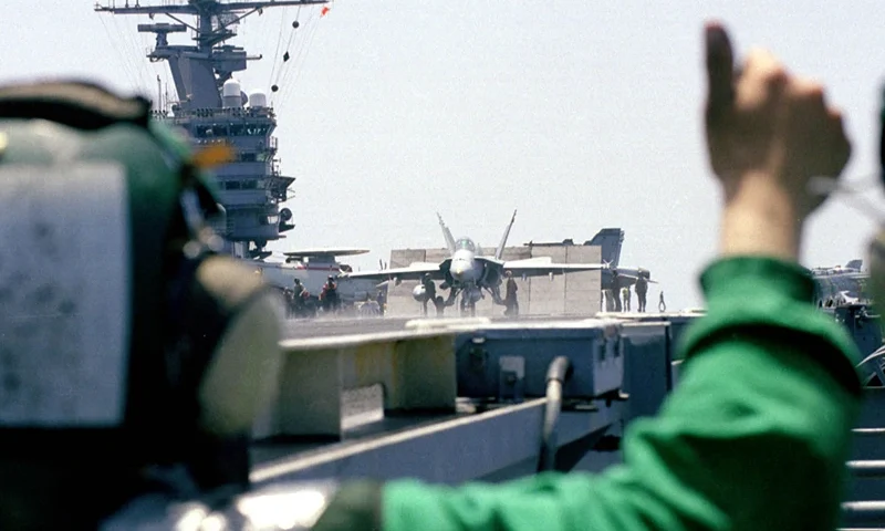A Waist Catapult Safety Observer Gives The Thumbs Up Signal That Indicates That This F-18 "Hornet" Is Free From Obstructions And Ready To Be Launched June 9, 1999 Aboard The USS Theodore Roosevelt. The Theodore Roosevelt And Its Embarked Carrier Airwing Are Participating In Air Strikes Against The Former Yugoslavia In Support Of Nato Operation Allied Force. (Photo By U.S. Navy/Getty Images)