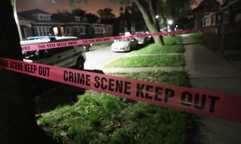 CHICAGO, IL - MAY 27: Crime scene tape is stretched around the front of a home where a man was shot on May 28, 2017 in Chicago, Illinois. Chicago police have added more than 1,000 officers to the streets over the Memorial Day weekend, hoping to put a dent in crime, during what is typically one of the more violent weekends of the year. In 2016, 6 people were killed and another 65 were wounded by gun violence over the Memorial Day weekend. (Photo by Scott Olson/Getty Images)