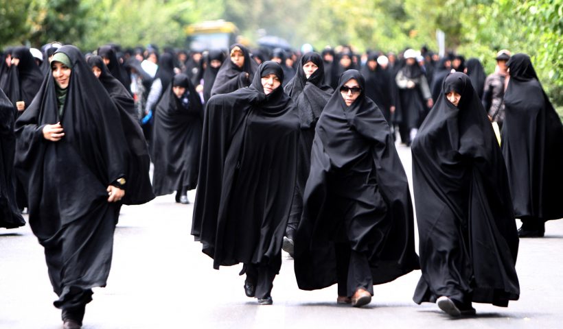 TOPSHOT - Iranian demonstrators march after weekly Friday prayers in Tehran on July 8, 2011 during a protest asking the government to intensify its crackdown on women and men to enforce the Islamic dress code. AFP PHOTO/ATTA KENARE (Photo by Atta KENARE / AFP) (Photo by ATTA KENARE/AFP via Getty Images)