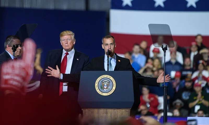 Former Trump Campaign manager Corey Lewandowski speaks as US President Donald Trump looks on during a rally at Total Sports Park in Washington, Michigan on April 28, 2018. (Photo by MANDEL NGAN / AFP) (Photo credit should read MANDEL NGAN/AFP via Getty Images)