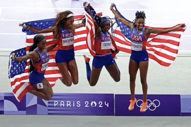 Gabrielle Thomas of United States, Sha'Carri Richardson of United States, Twanisha Terry of United States and Melissa Jefferson of United States celebrate after winning gold. REUTERS/Phil Noble