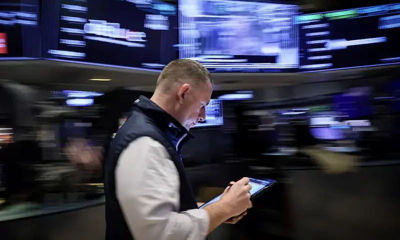 A trader works on the floor at the New York Stock Exchange (NYSE) in New York City, U.S., March 7, 2024. REUTERS/Brendan McDermid/File Photo