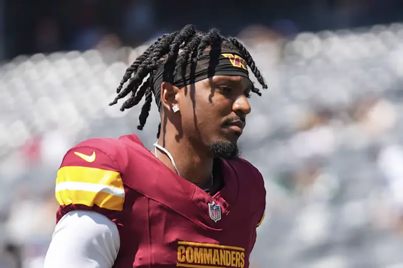 Washington Commanders quarterback Jayden Daniels (5) exits the field before the game against the New York Jets at MetLife Stadium. Mandatory Credit: Lucas Boland-USA TODAY Sports/File Photo