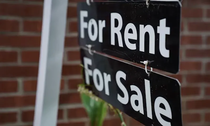 A "For Rent, For Sale" sign is seen outside of a home in Washington, U.S., July 7, 2022. REUTERS/Sarah Silbiger/File Photo