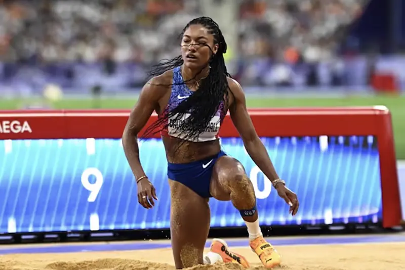 Tara Davis-Woodhall of United States reacts after her jump. REUTERS/Dylan Martinez