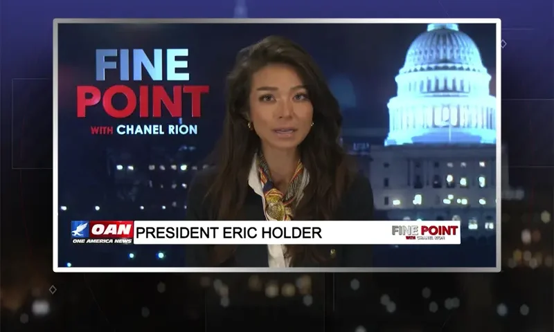Video still of the host of Fine Point at the desk of their talk show on One America News Network.