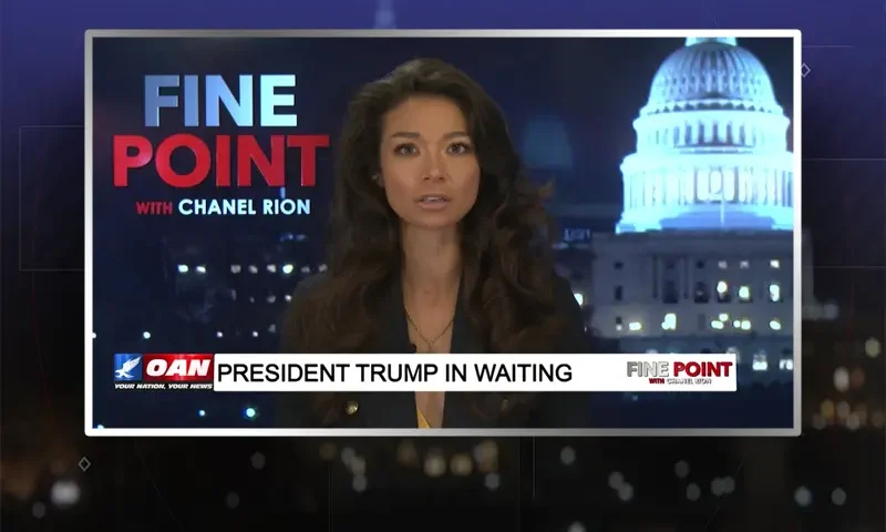 Video still of the host of Fine Point at the desk of their talk show on One America News Network.