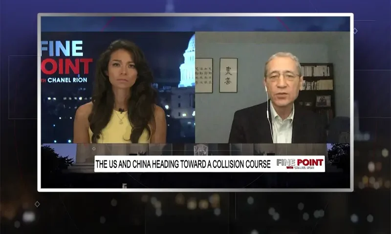 Video still from Fine Point on One America News Network showing a split screen of the host on the left side, and on the right side is the guest, Gordon Chang.
