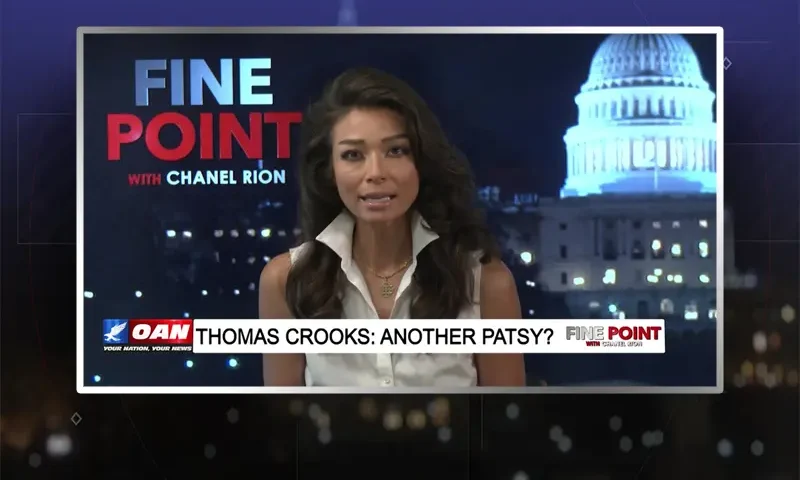Video still of the host of Fine Point at the desk of their talk show on One America News Network.