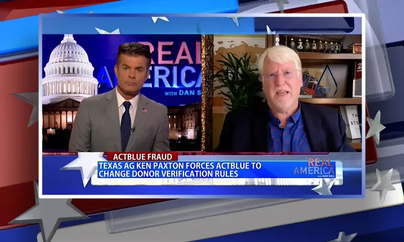 Video still from Real America on One America News Network showing a split screen of the host on the left side, and on the right side is the guest, Joe Hoft.