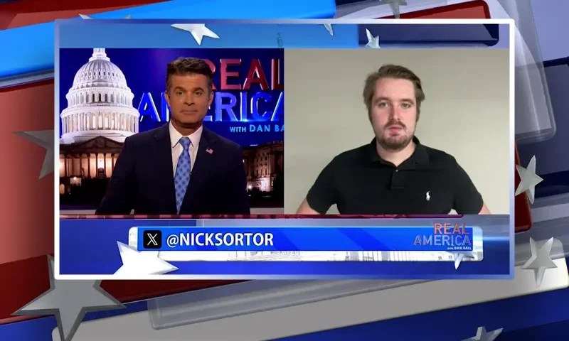 Video still from Real America on One America News Network showing a split screen of the host on the left side, and on the right side is the guest, Nick Sortor.