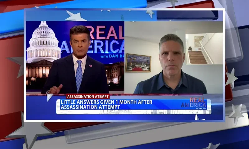 Video still from Real America on One America News Network showing a split screen of the host on the left side, and on the right side is the guest, Jim Hellmold.