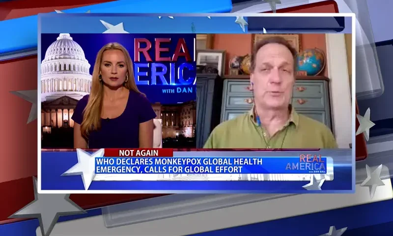 Video still from Real America on One America News Network showing a split screen of the host on the left side, and on the right side is the guest, James Roguski.