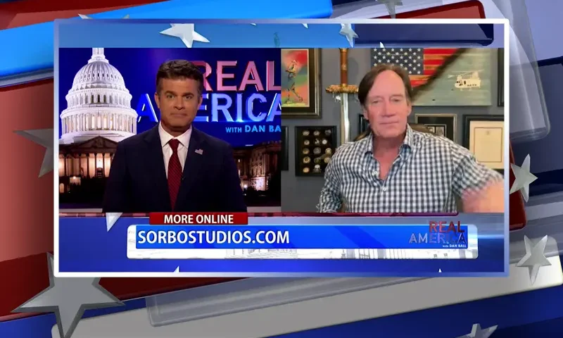 Video still from Real America on One America News Network showing a split screen of the host on the left side, and on the right side is the guest, Kevin Sorbo.