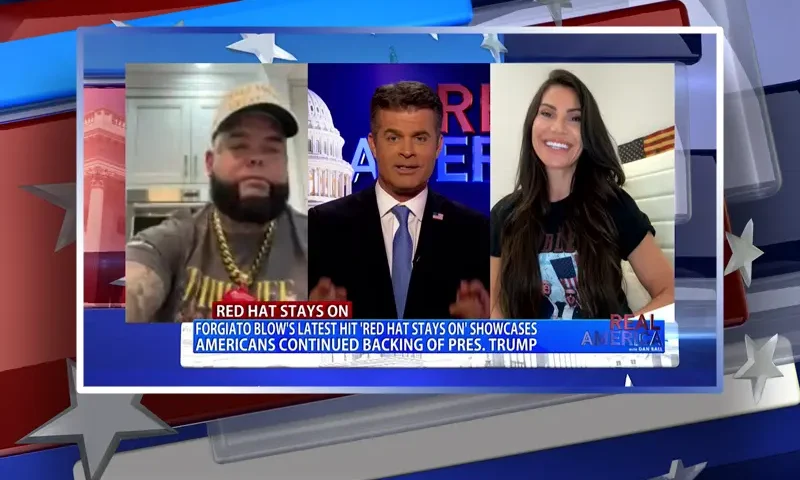 Video still from Real America on One America News Network during an interview with the guest, Forgiato Blow and Hadas Levy.