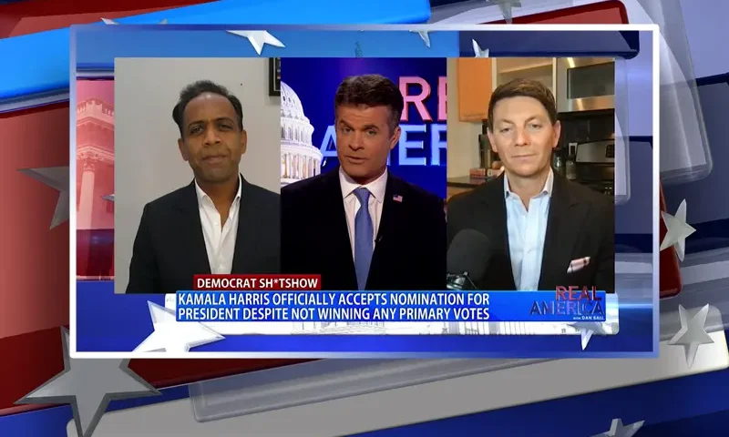 Video still from Real America on One America News Network during an interview with the guest, Hogan Gidley and Raj Goyle.