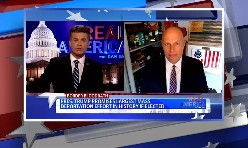Video still from Real America on One America News Network showing a split screen of the host on the left side, and on the right side is the guest, Ron Vitiello.