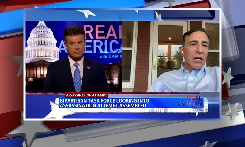 Video still from Real America on One America News Network showing a split screen of the host on the left side, and on the right side is the guest, Rep. Darrell Issa.
