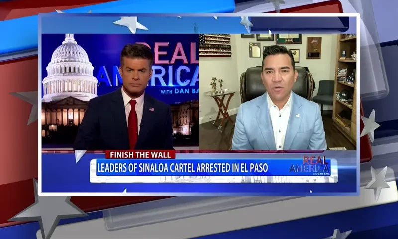 Video still from Real America on One America News Network showing a split screen of the host on the left side, and on the right side is the guest, Victor Avila.