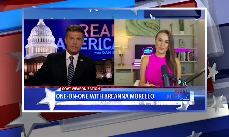 Video still from Real America on One America News Network showing a split screen of the host on the left side, and on the right side is the guest, Breanna Morello.