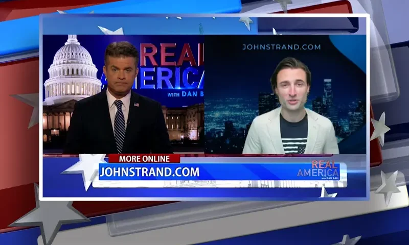 Video still from Real America on One America News Network showing a split screen of the host on the left side, and on the right side is the guest, John Strand.