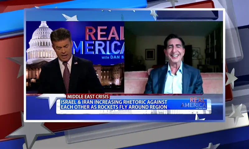 Video still from Real America on One America News Network showing a split screen of the host on the left side, and on the right side is the guest, Harley Lippman.