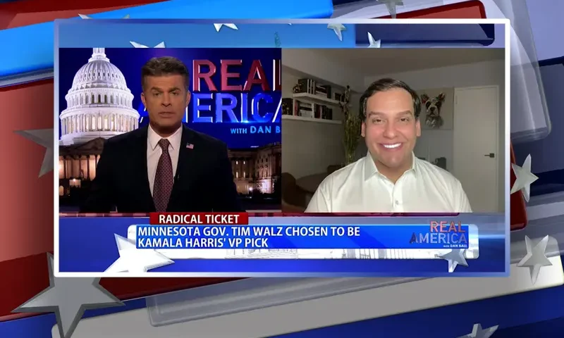 Video still from Real America on One America News Network showing a split screen of the host on the left side, and on the right side is the guest, George Santos.