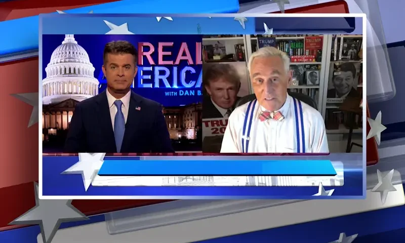 Video still from Real America on One America News Network showing a split screen of the host on the left side, and on the right side is the guest, Roger Stone.