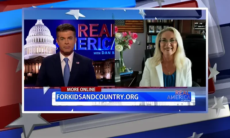 Video still from Real America on One America News Network showing a split screen of the host on the left side, and on the right side is the guest, Rebecca Friedrichs.