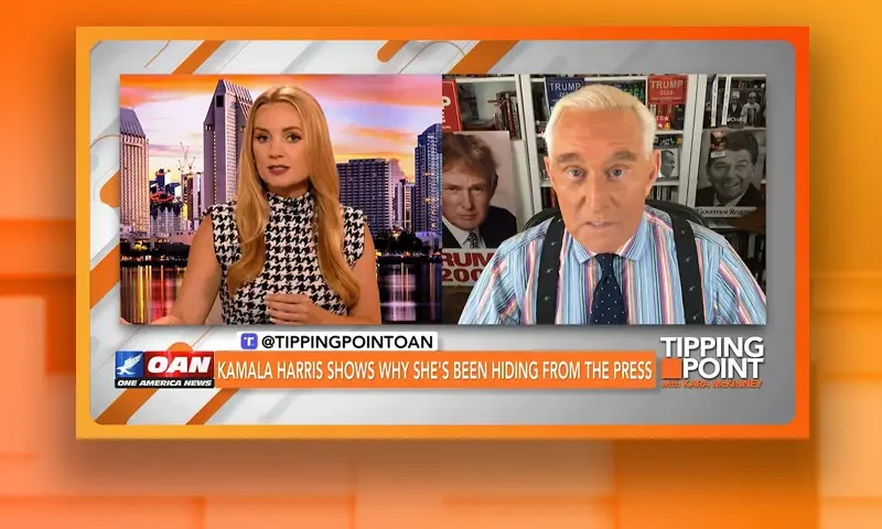 Video still from Tipping Point on One America News Network showing a split screen of the host on the left side, and on the right side is the guest, Roger Stone.