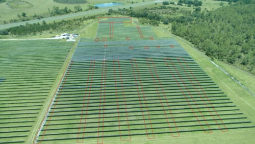 Aerial photo of the solar panel field Hnaihen attacked with targeted panel areas outlined in red (Department of Justice)